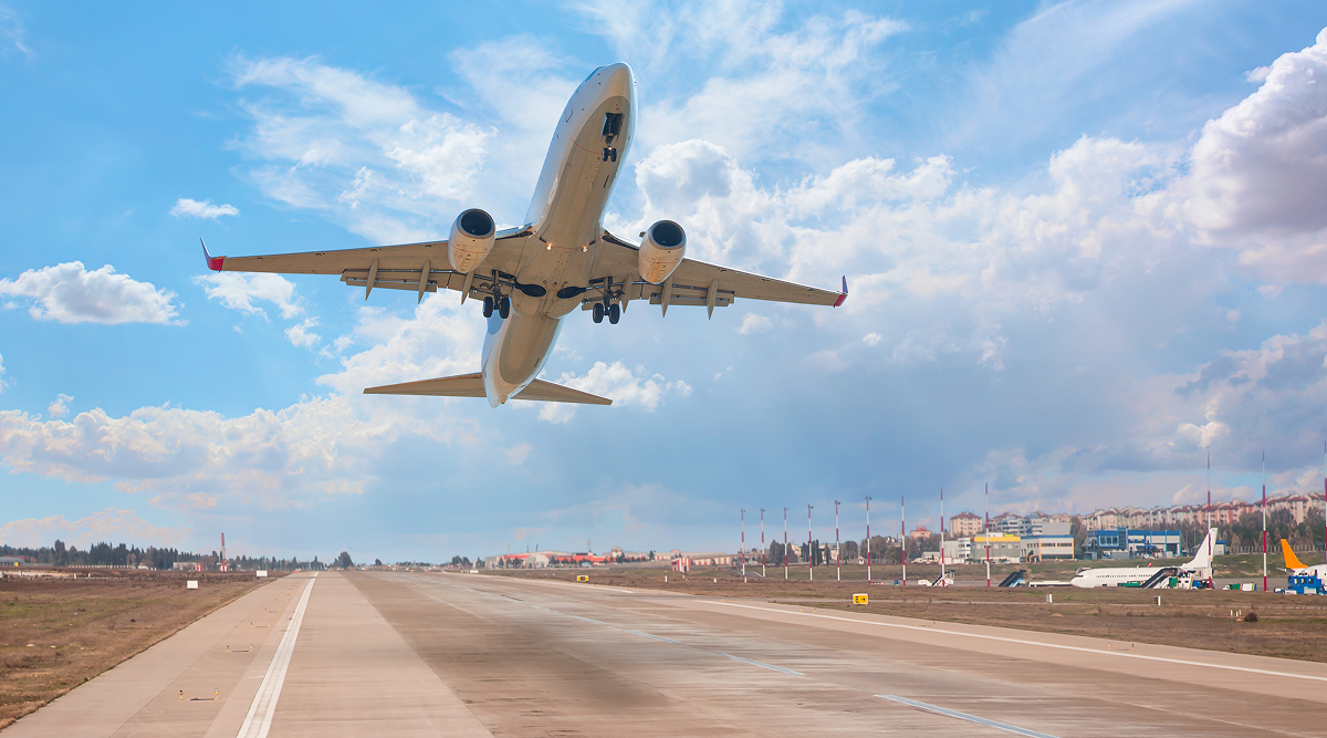plane at an airport taking off