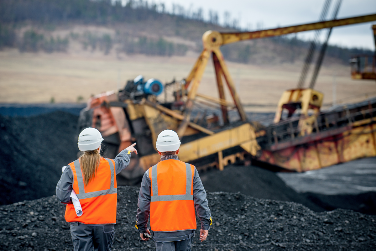 two-co-workers-on-a-coal-mining-site
