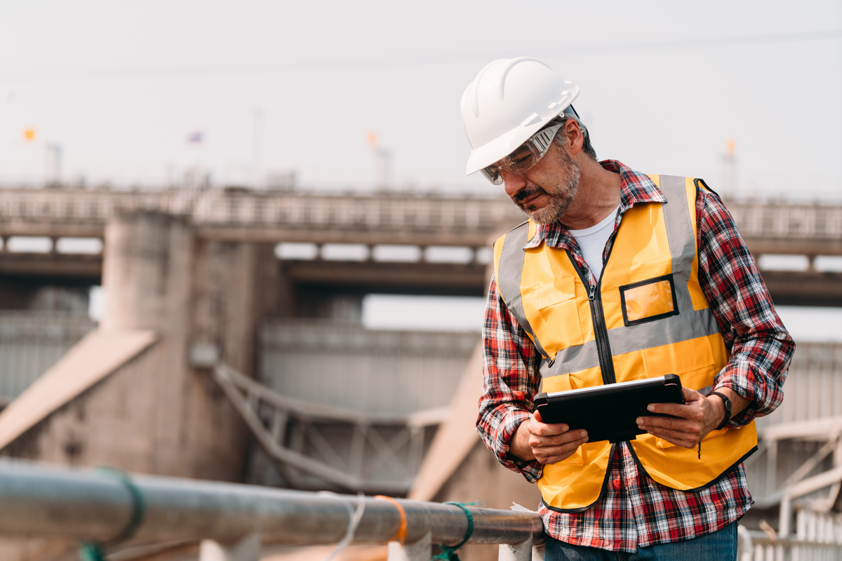 worker-looking-at-computer-on-site